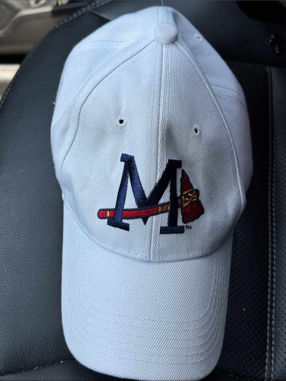 Mississippi Braves White Baseball Cap with Embroidered 'M' and Tomahawk Logo